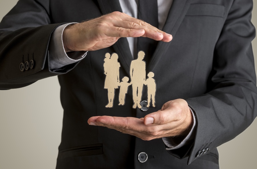 man in suit protecting family paper cutout 2026 01 09 11 13 38 utc